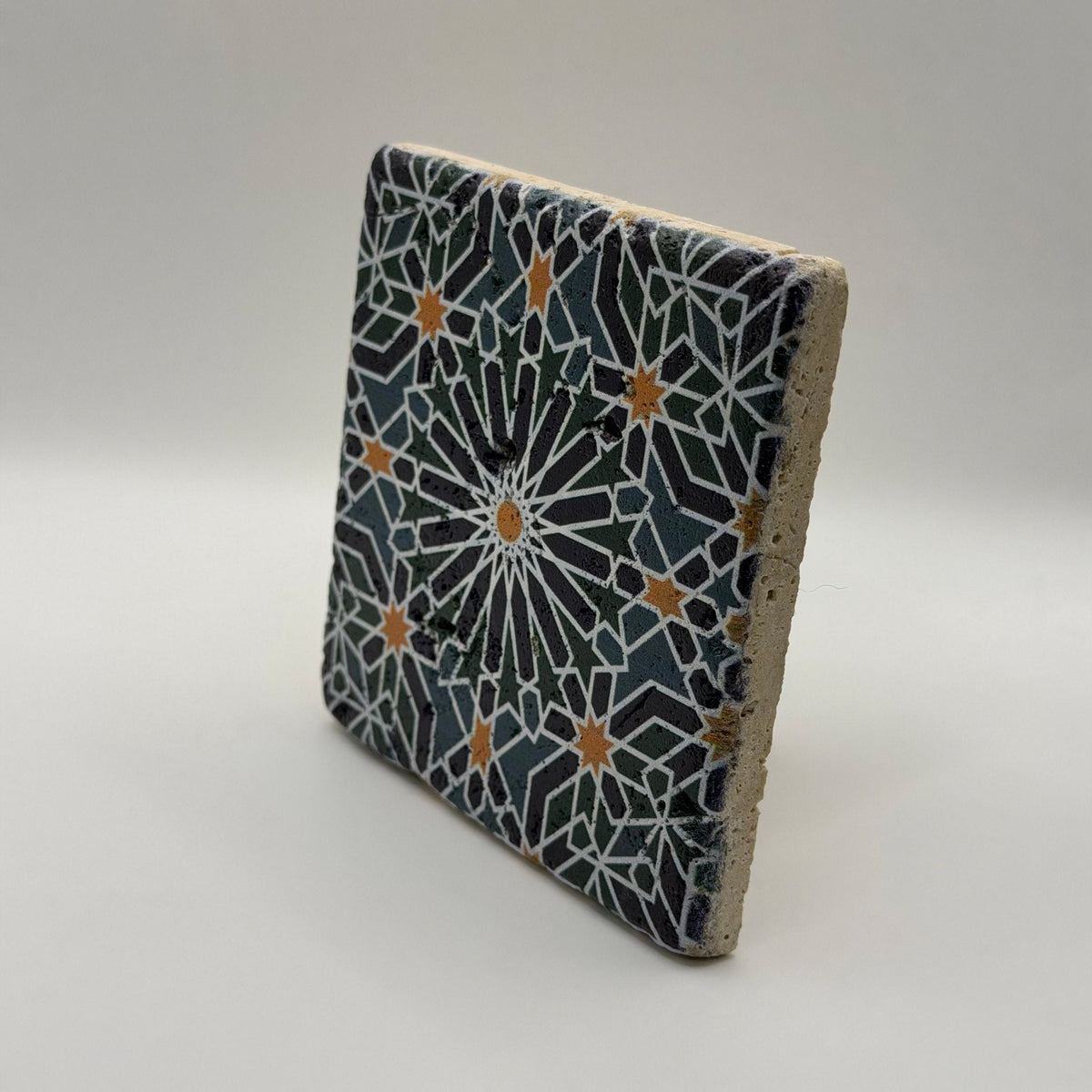 Ethnics pattern number 46 printed on a natural travertine stone coaster
