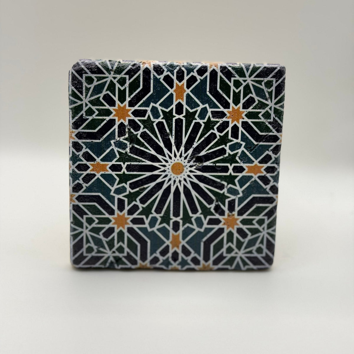 Ethnics pattern number 46 printed on a natural travertine stone coaster