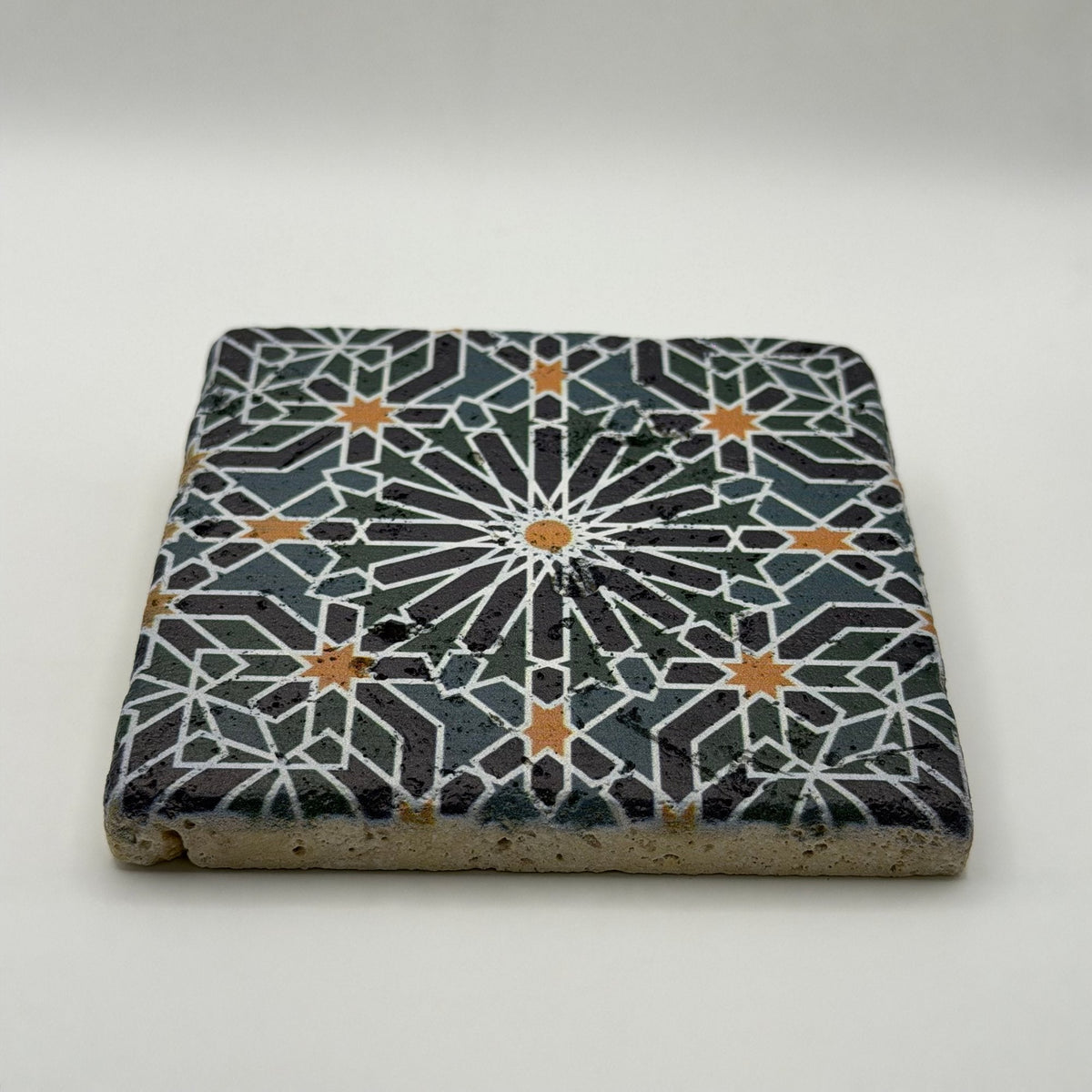 Ethnics pattern number 46 printed on a natural travertine stone coaster
