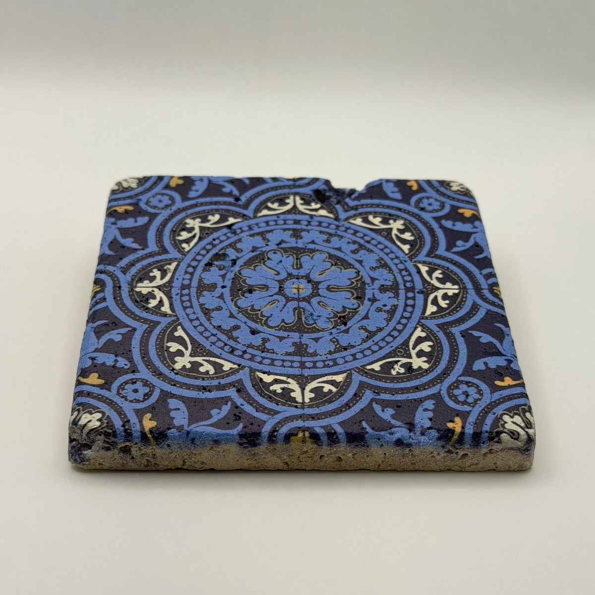 Ethnics pattern number 47 printed on a natural travertine stone coaster