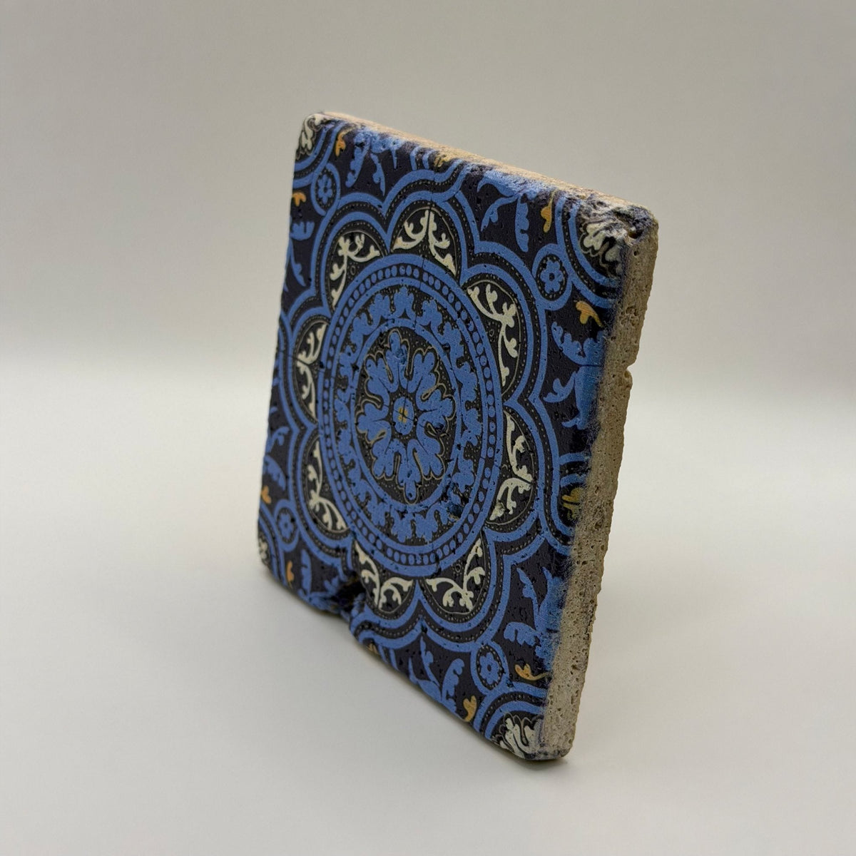 Ethnics pattern number 47 printed on a natural travertine stone coaster