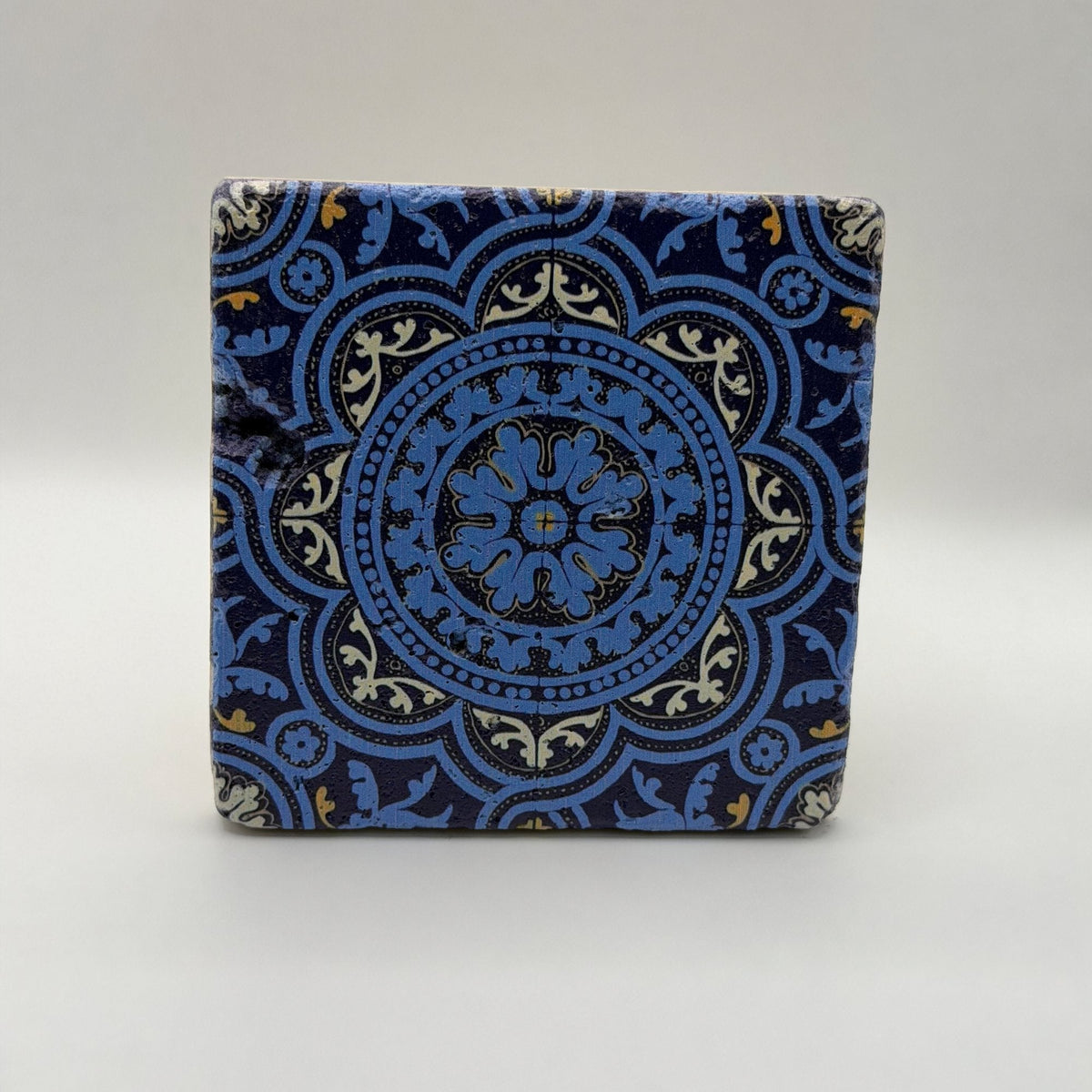 Ethnics pattern number 47 printed on a natural travertine stone coaster