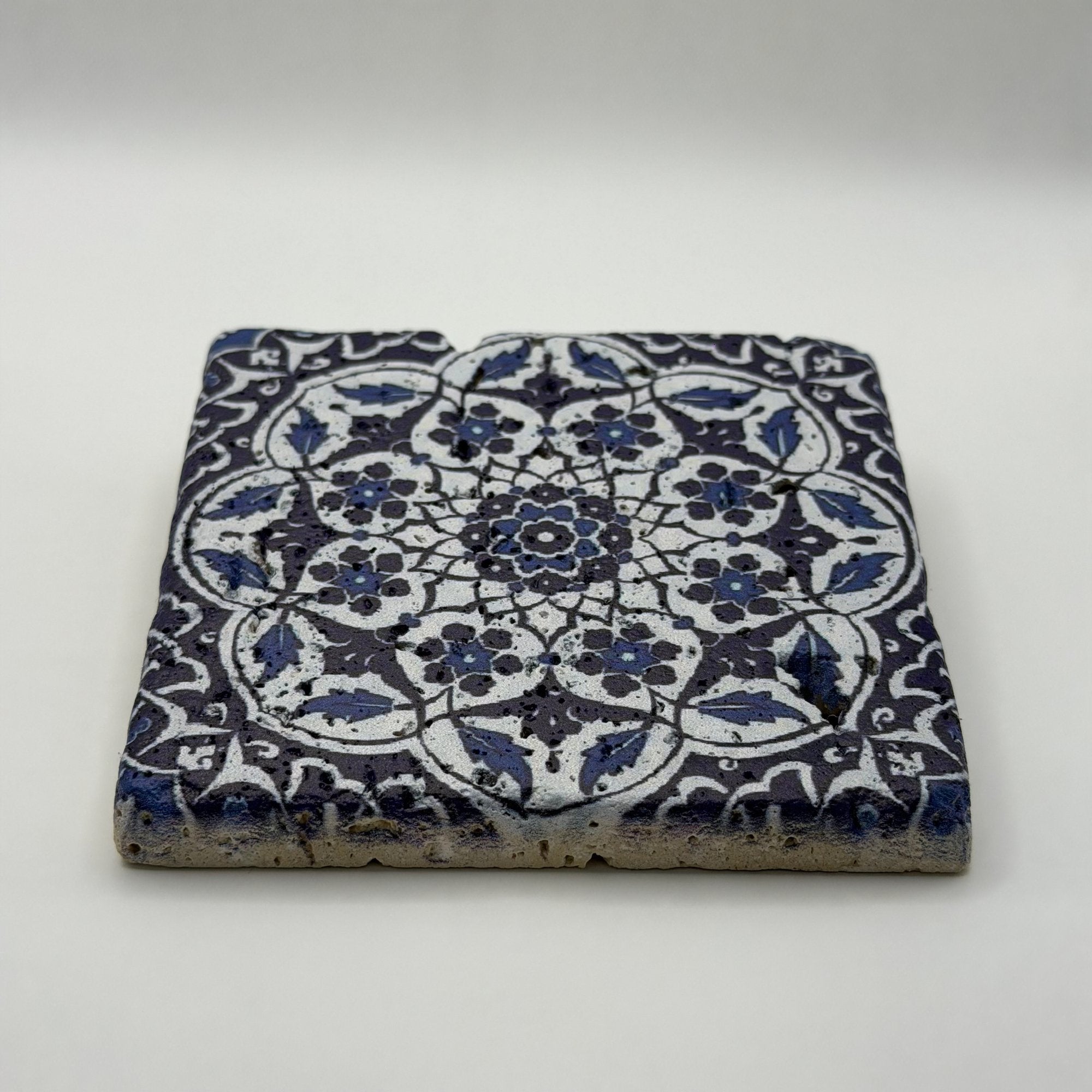 Ethnics pattern number 48 printed on a natural travertine stone coaster
