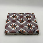 Ethnics pattern number 49 printed on a natural travertine stone coaster