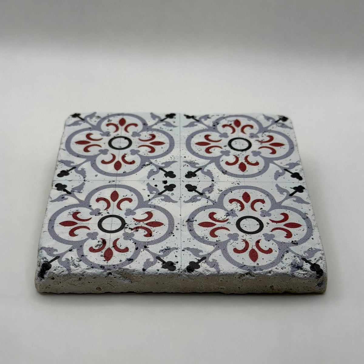 Ethnics pattern number 50 printed on a natural travertine stone coaster