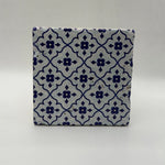 Ethnics pattern number 51 printed on a natural travertine stone coaster