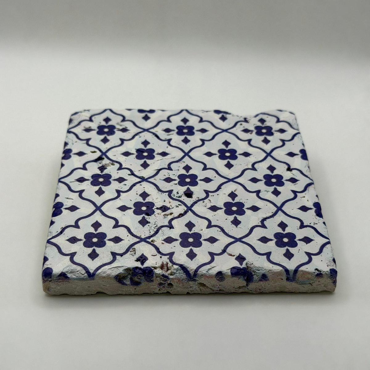 Ethnics pattern number 51 printed on a natural travertine stone coaster