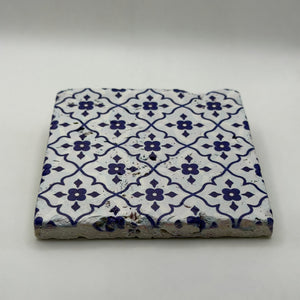Ethnics pattern number 51 printed on a natural travertine stone coaster