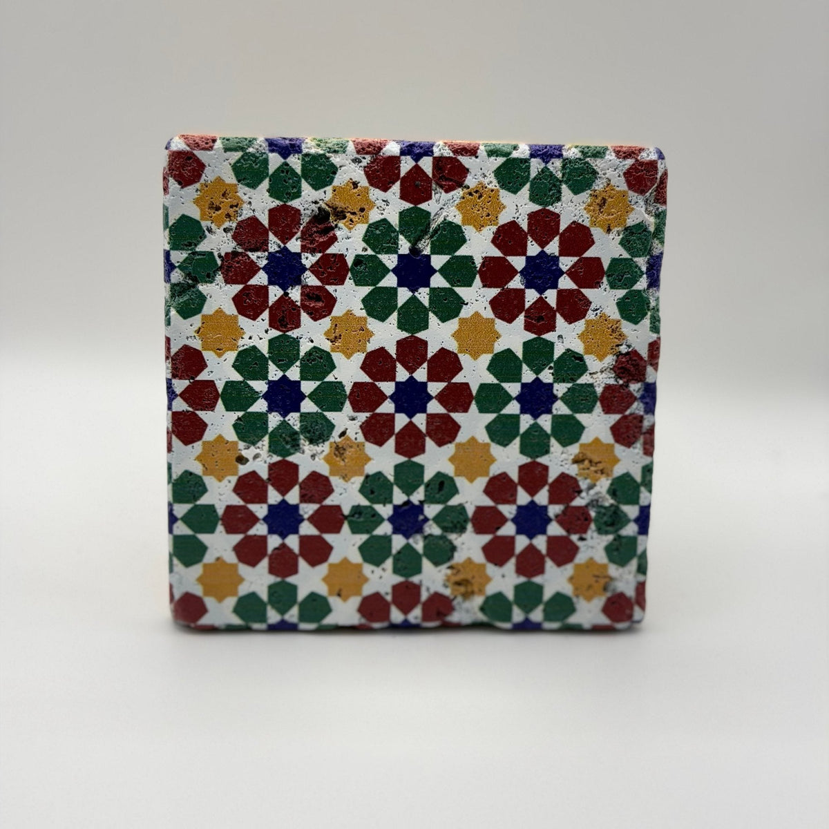 Ethnics pattern number 52 printed on a natural travertine stone coaster