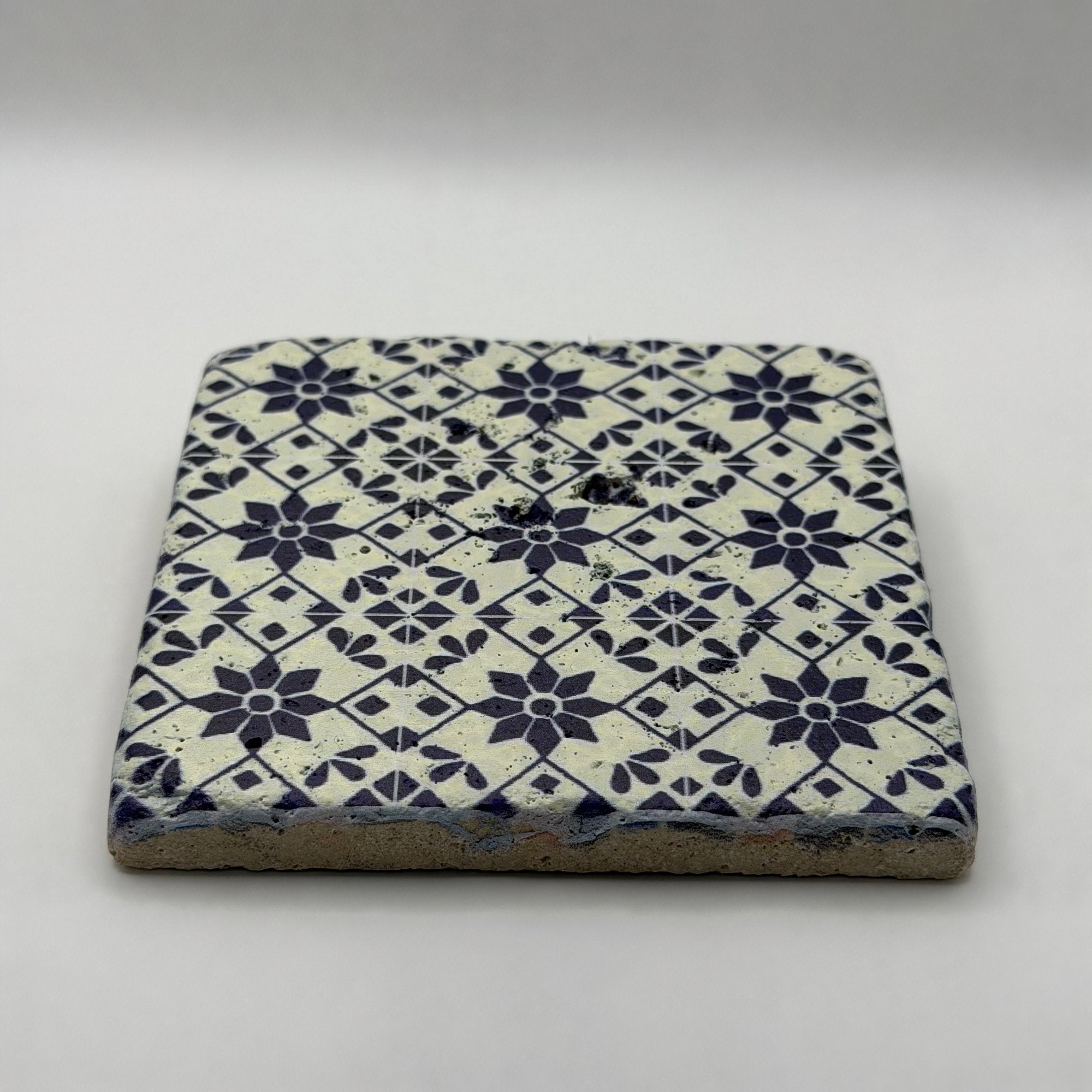 Ethnics pattern number 53 printed on a natural travertine stone coaster
