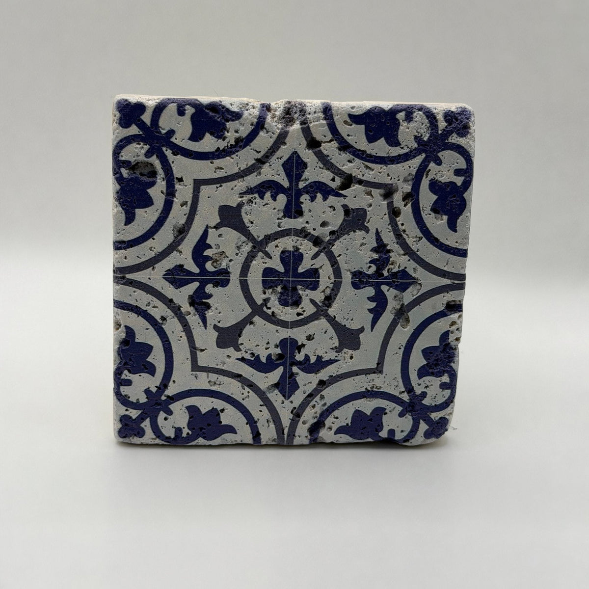 Ethnics pattern number 54 printed on a natural travertine stone coaster