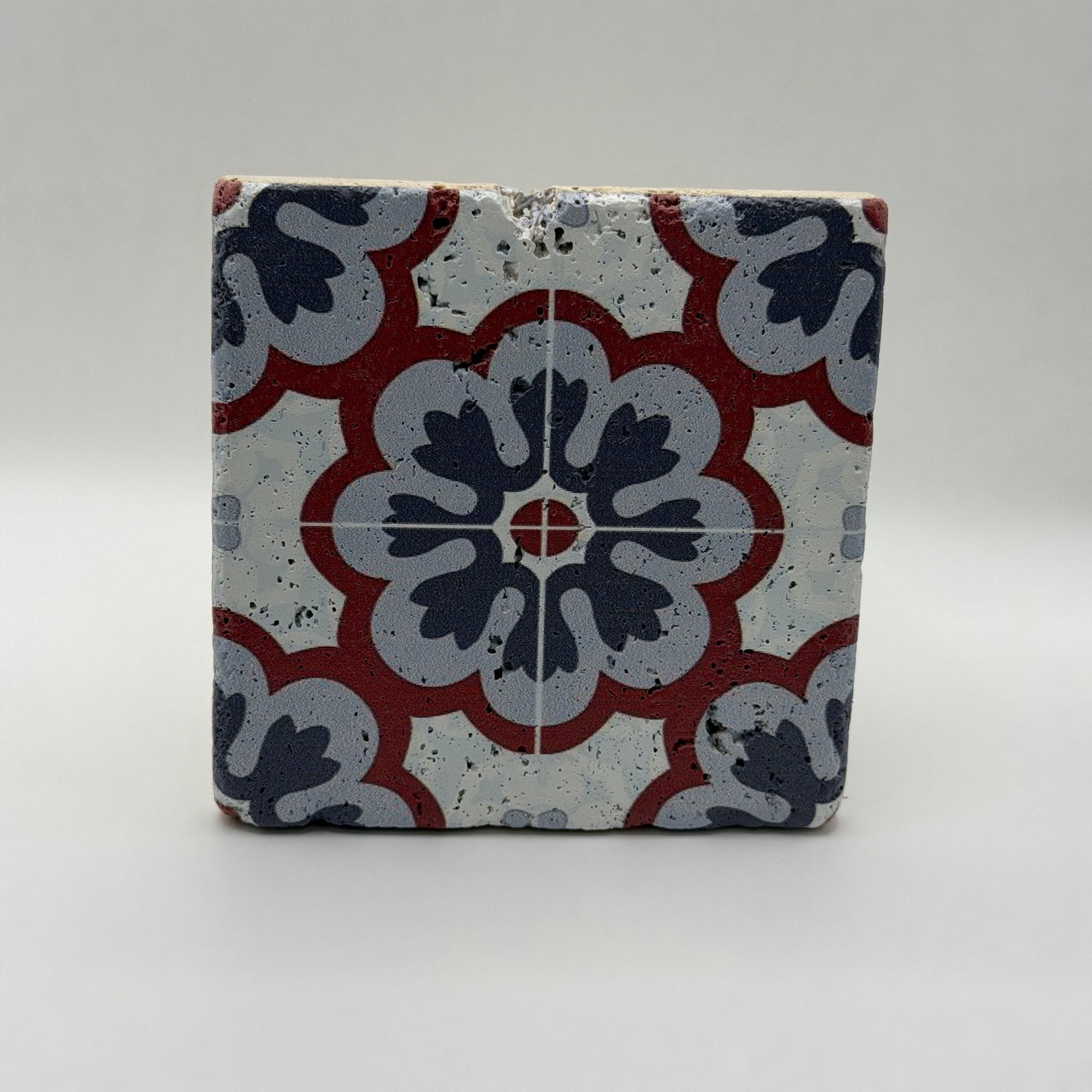 Ethnics pattern number 55 printed on a natural travertine stone coaster