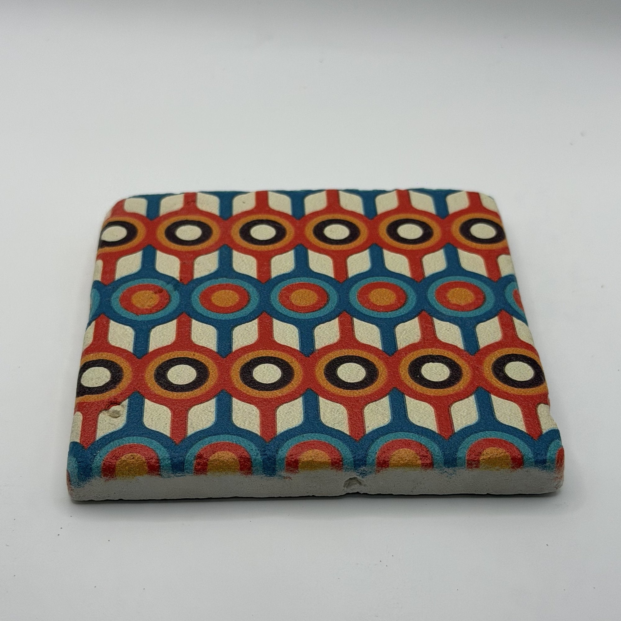 Ethnics pattern number 58 printed on a natural travertine stone coaster