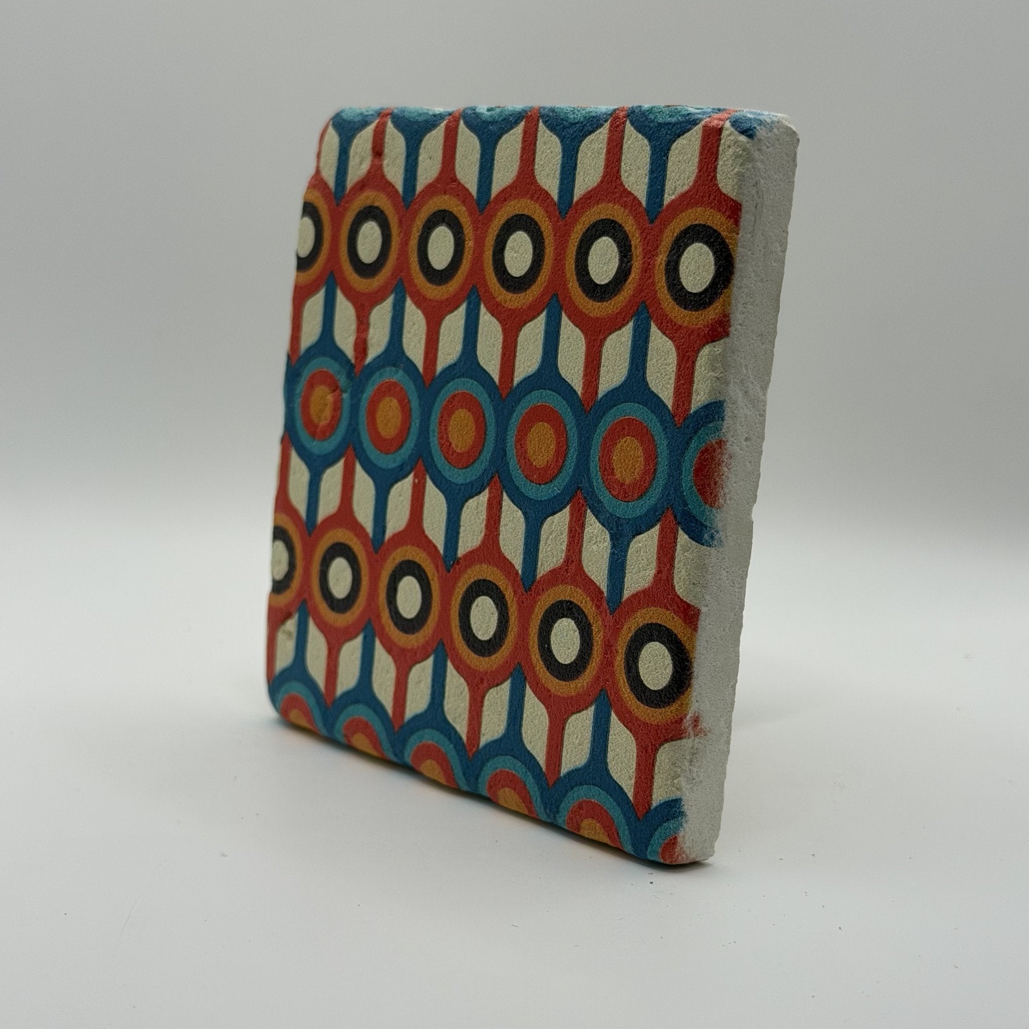 Ethnics pattern number 58 printed on a natural travertine stone coaster