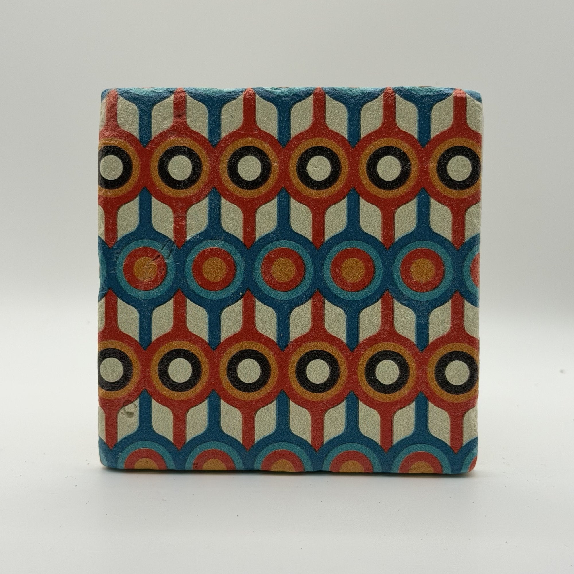 Ethnics pattern number 58 printed on a natural travertine stone coaster