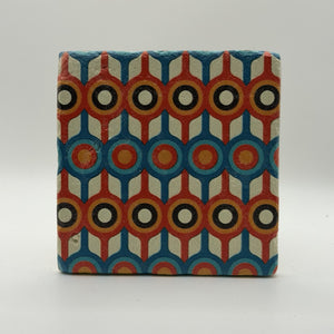 Ethnics pattern number 58 printed on a natural travertine stone coaster