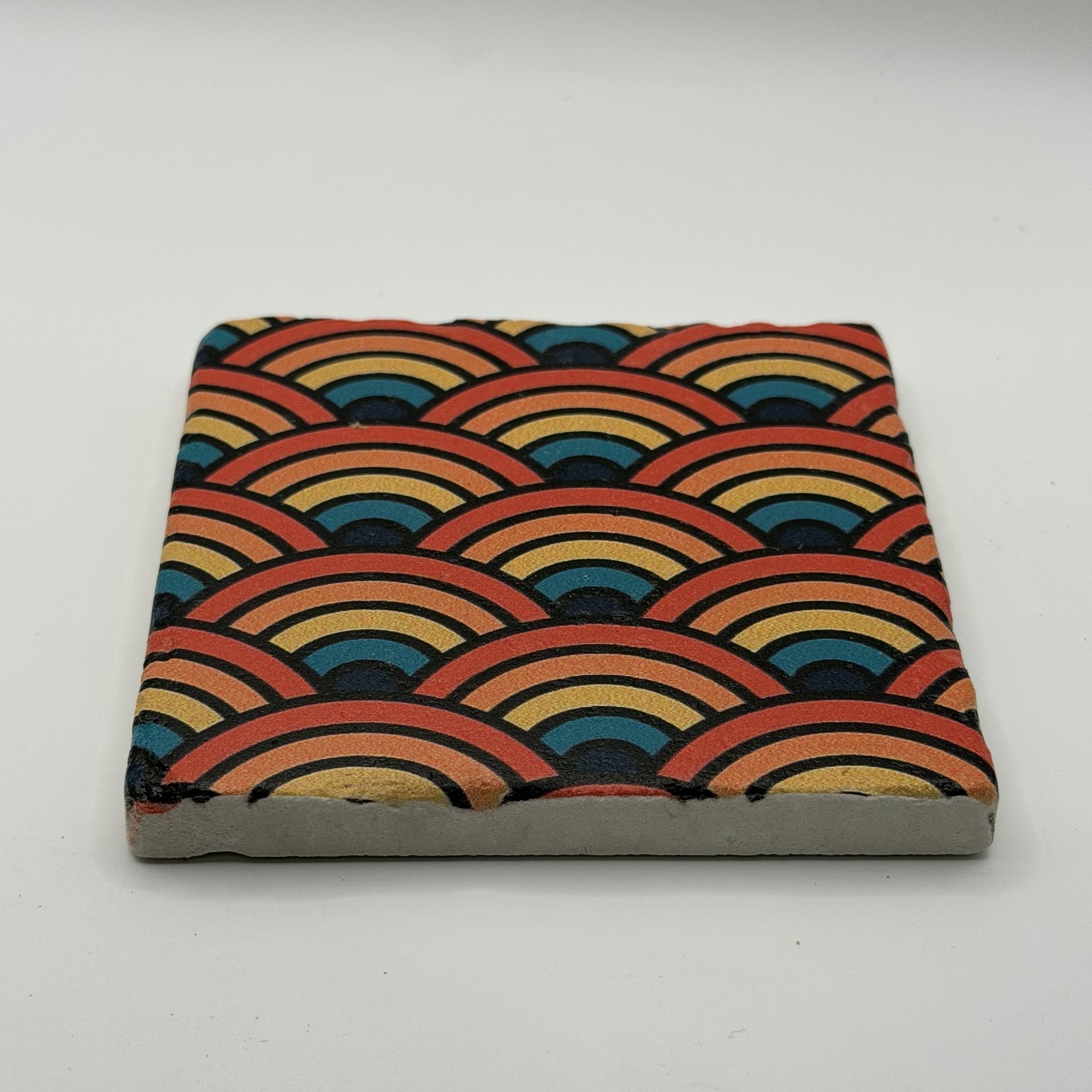 Ethnics pattern number 59 printed on a natural travertine stone coaster