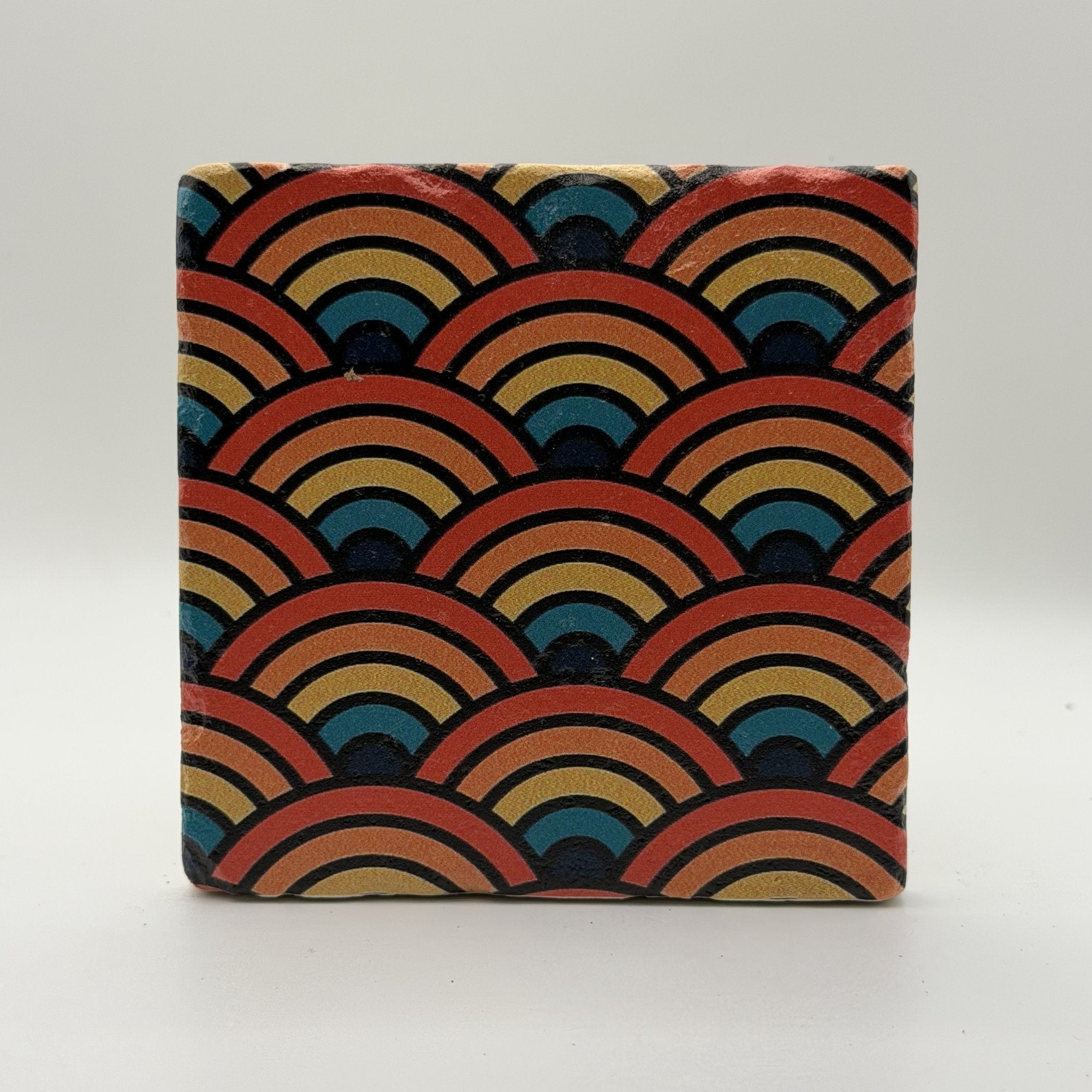 Ethnics pattern number 59 printed on a natural travertine stone coaster