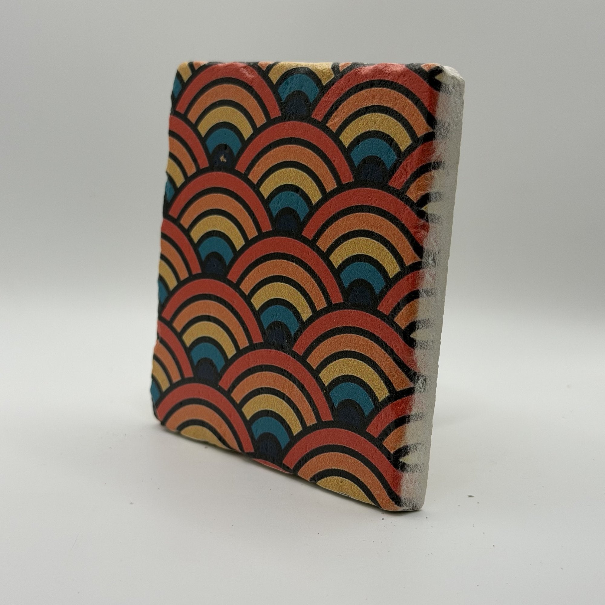 Ethnics pattern number 59 printed on a natural travertine stone coaster