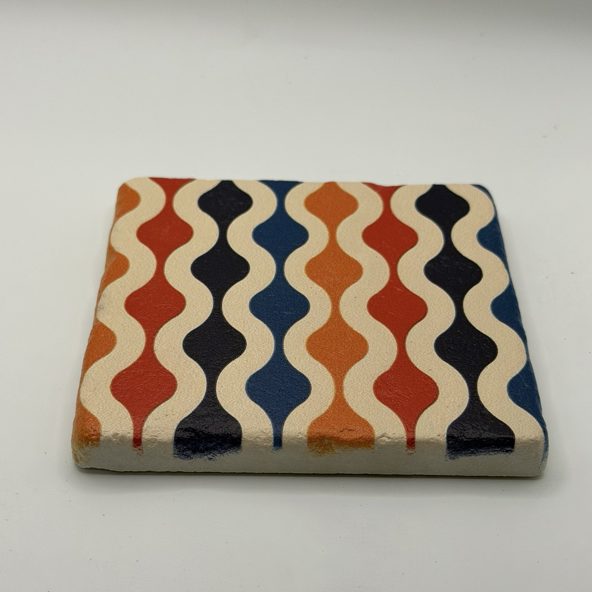 Ethnics pattern number 60 printed on a natural travertine stone coaster