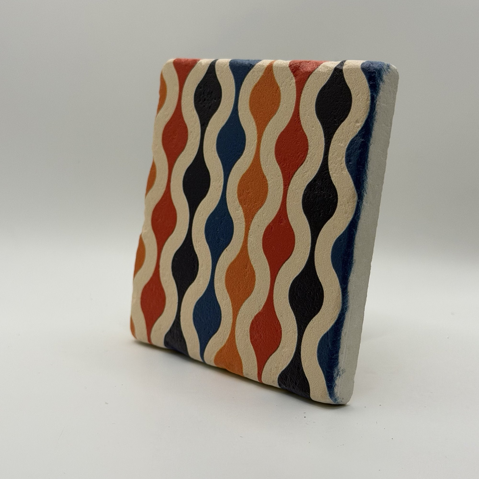 Ethnics pattern number 60 printed on a natural travertine stone coaster