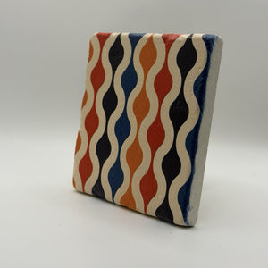 Ethnics pattern number 60 printed on a natural travertine stone coaster