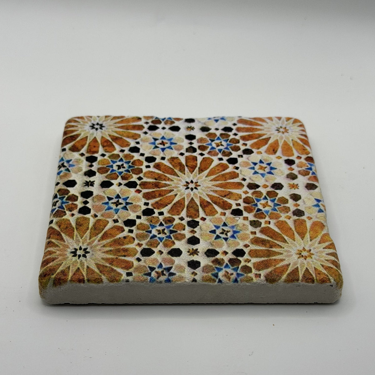 Ethnics pattern number 61 printed on a natural travertine stone coaster