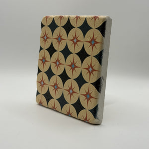 Ethnics pattern number 63 printed on a natural travertine stone coaster