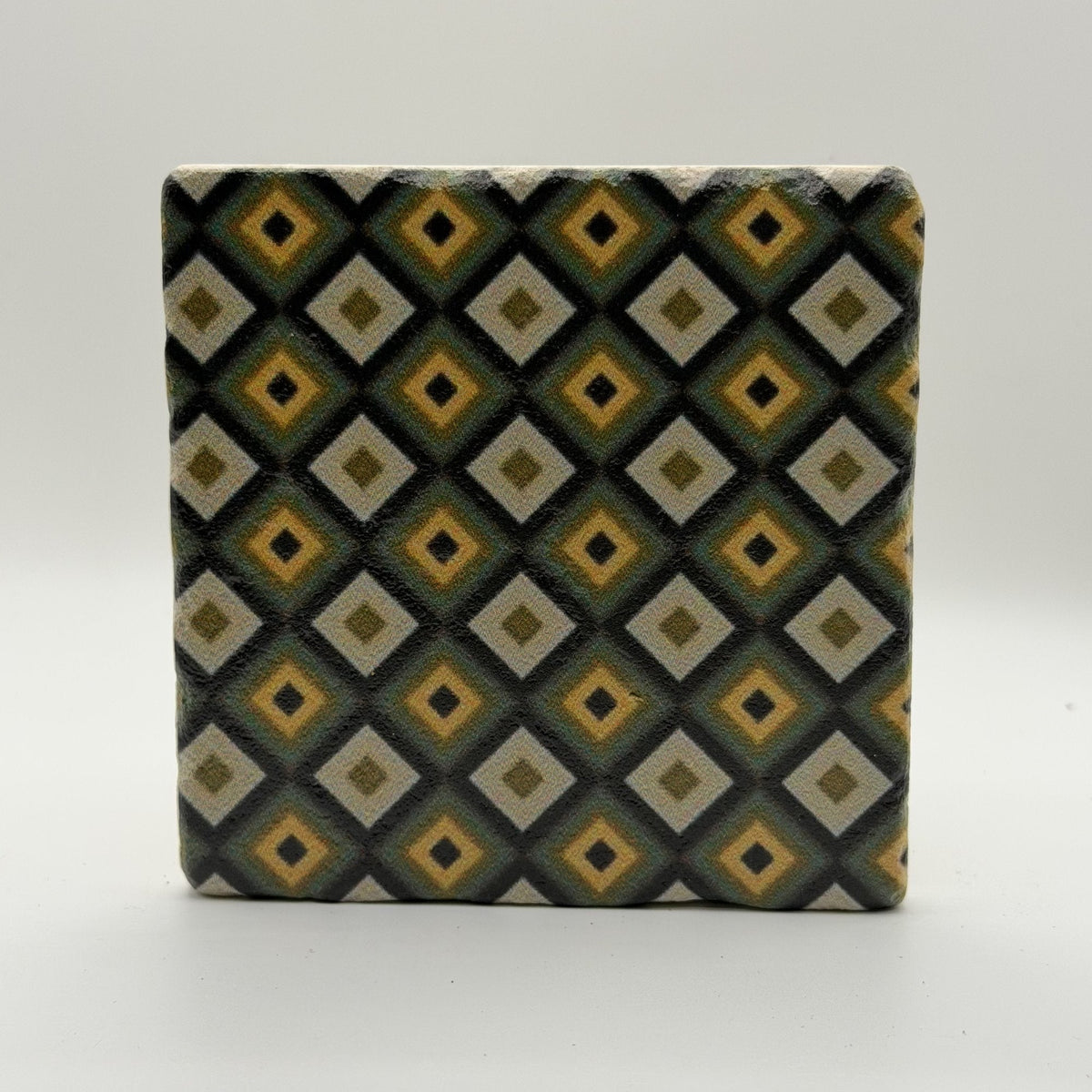 Ethnics pattern number 64 printed on a natural travertine stone coaster