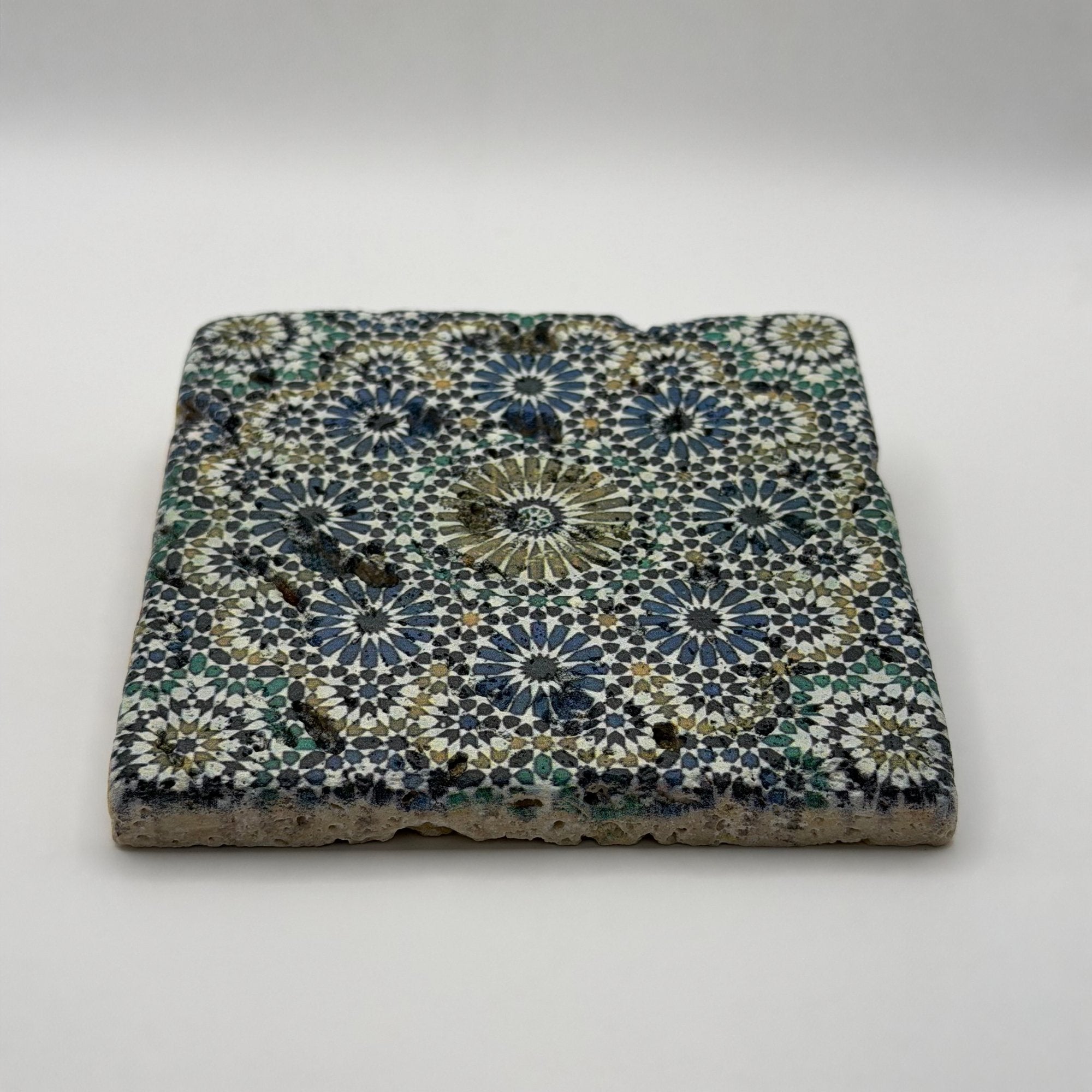 Ethnic pattern number 33 printed on a natural stone coaster