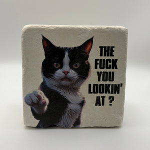 Funny quote 'The fuck you lookin at?' printed on square travertine stone coaster