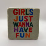 Funny quote 'Girls Just Wanna Have Fun' printed on square travertine stone coaster