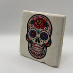Glittered skull artwork printed on square travertine stone coaster