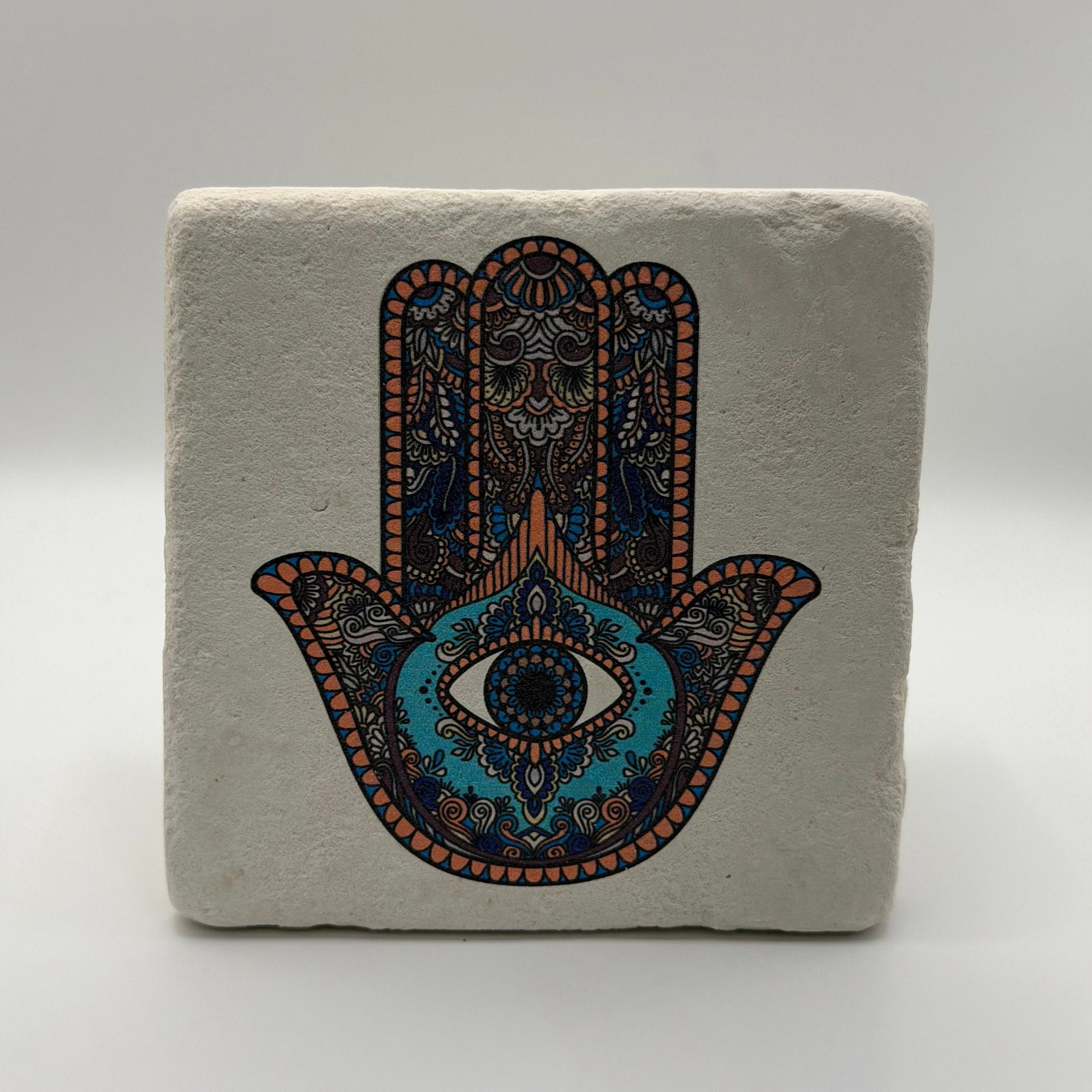 Hamsa Hand symbol printed on square travertine stone coaster