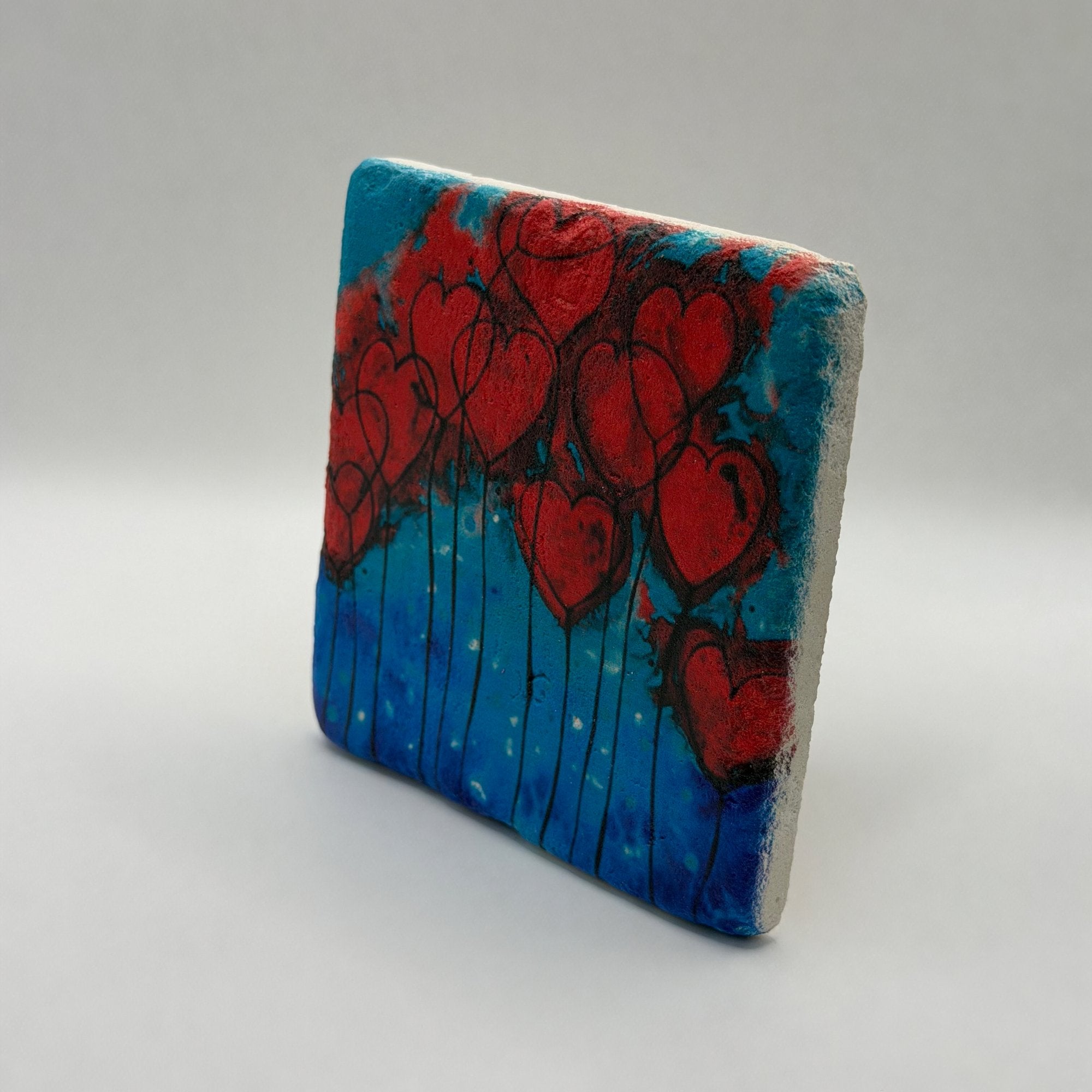 Hearts on fire design printed on square natural travertine stone coaster