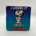 Funny slogan 'I Licked It So It's Mine' printed on square natural travertine stone coaster