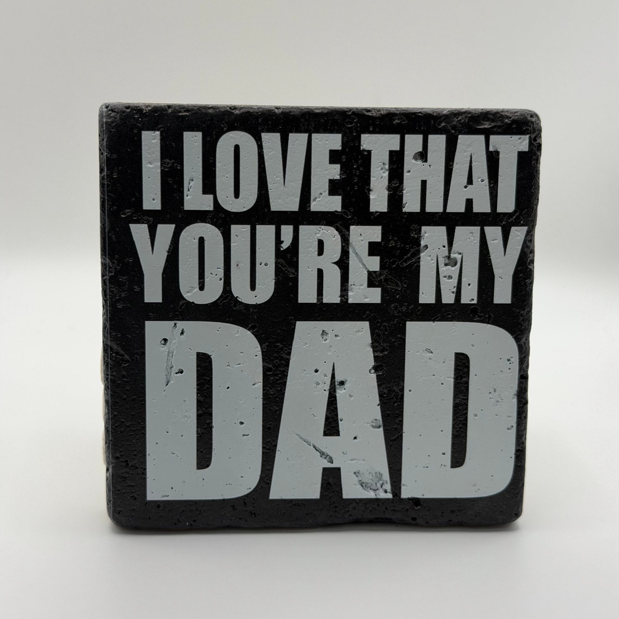 I Love That Youre My Dad slogan printed on square travertine stone coaster