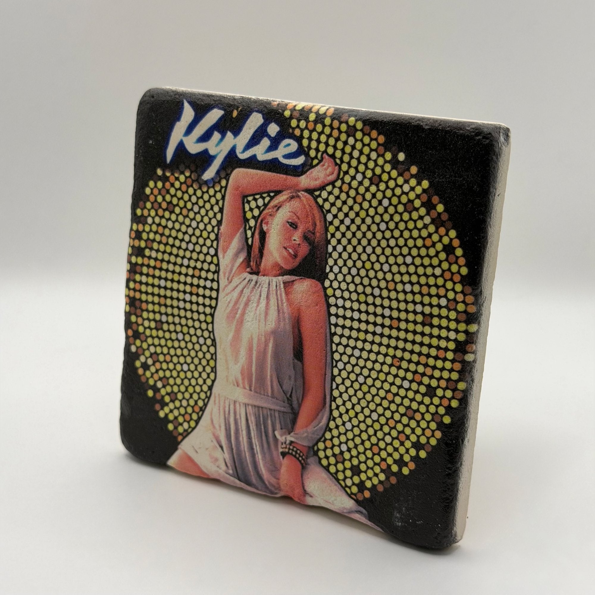 Kylie Minogue artwork printed on square travertine stone coaster