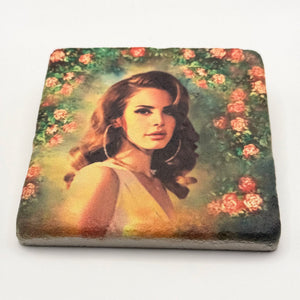 Lana Del Rey artwork featuring rose wreath design printed on square travertine stone coaster