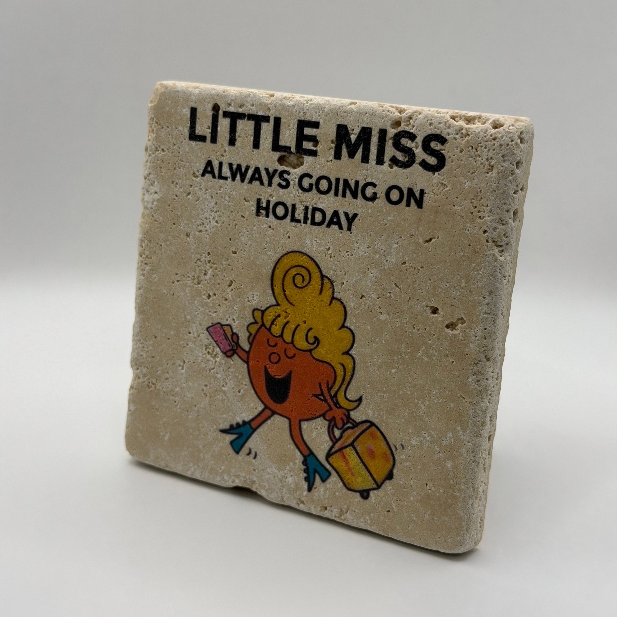Little Miss Always Going On Holiday artwork printed on square travertine stone coaster