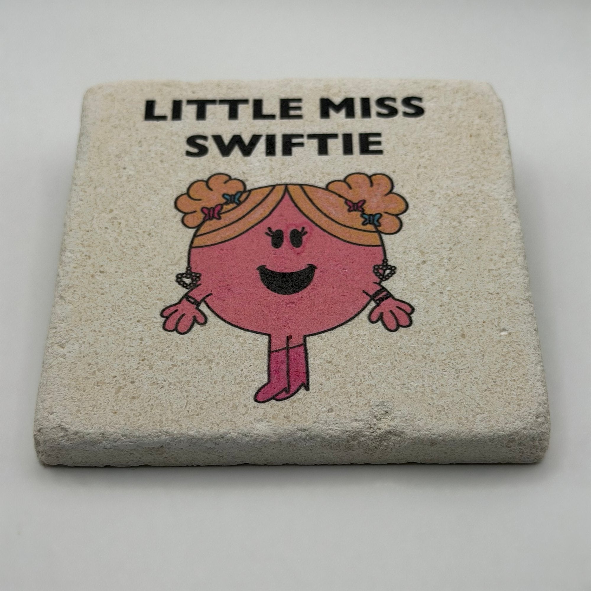 Little Miss Swiftie artwork printed on square travertine stone coaster