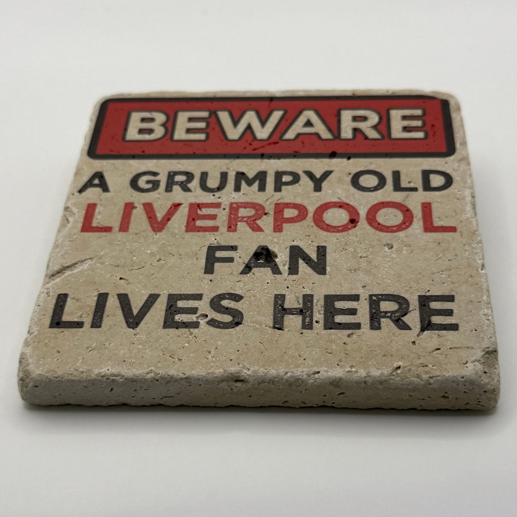 Grumpy old Liverpool fan design printed on square travertine stone coaster