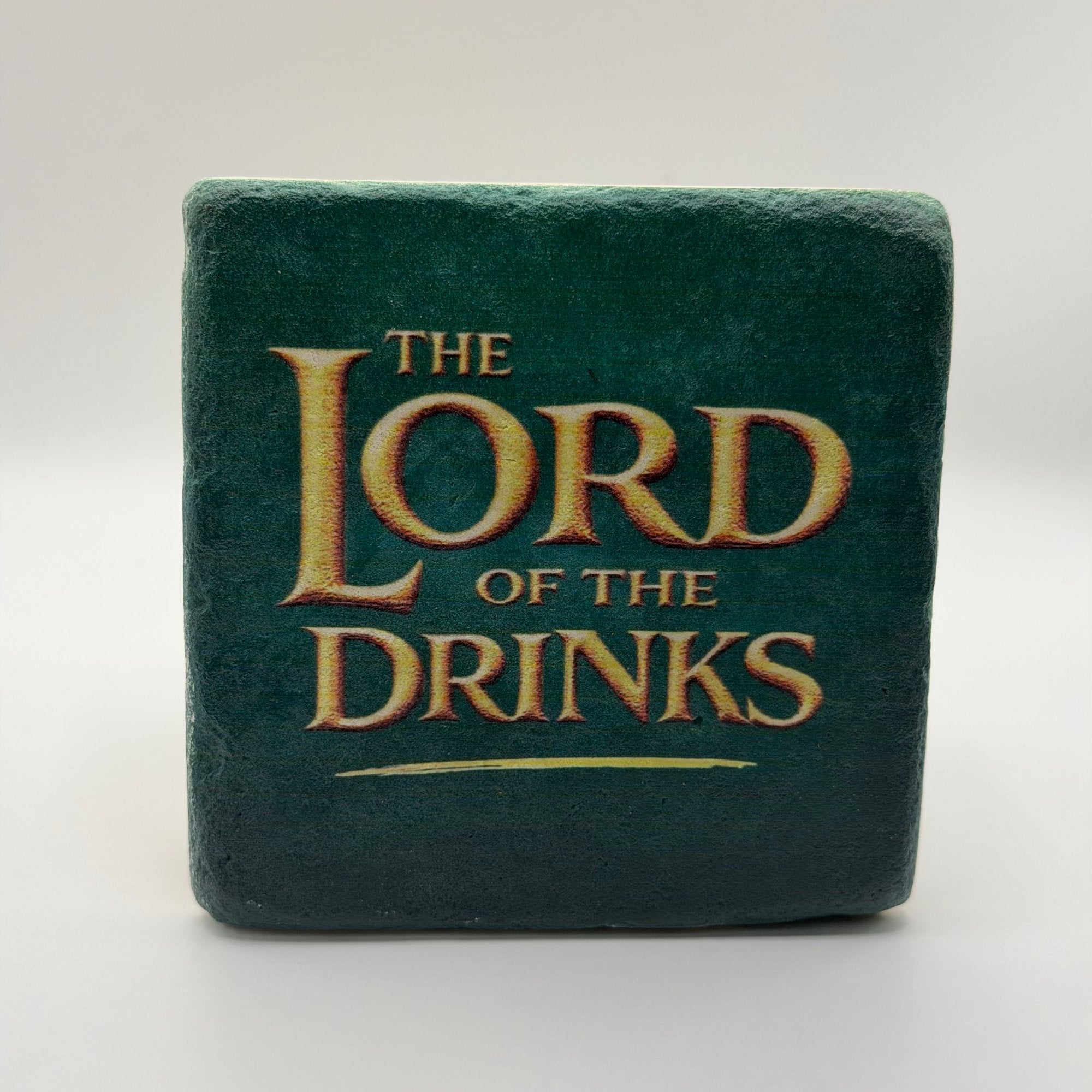 Funny slogan 'The Lord of the Drinks' printed on square travertine stone coaster