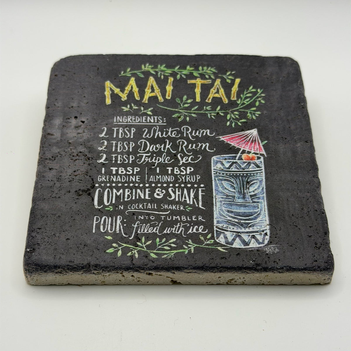 Tiki-inspired Mai Tai artwork printed on square natural travertine stone coaster