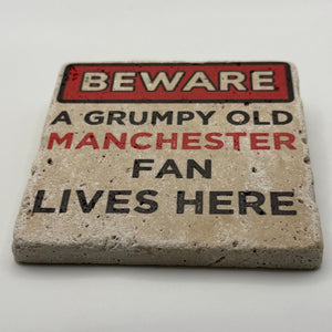 Grumpy old Manchester United fan artwork printed on square travertine stone coaster