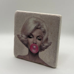 Marilyn Monroe's iconic pink bubble artwork printed on square natural travertine stone coaster