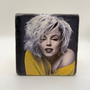Yellow iconography inspired by Marilyn Monroe printed on square travertine stone coaster