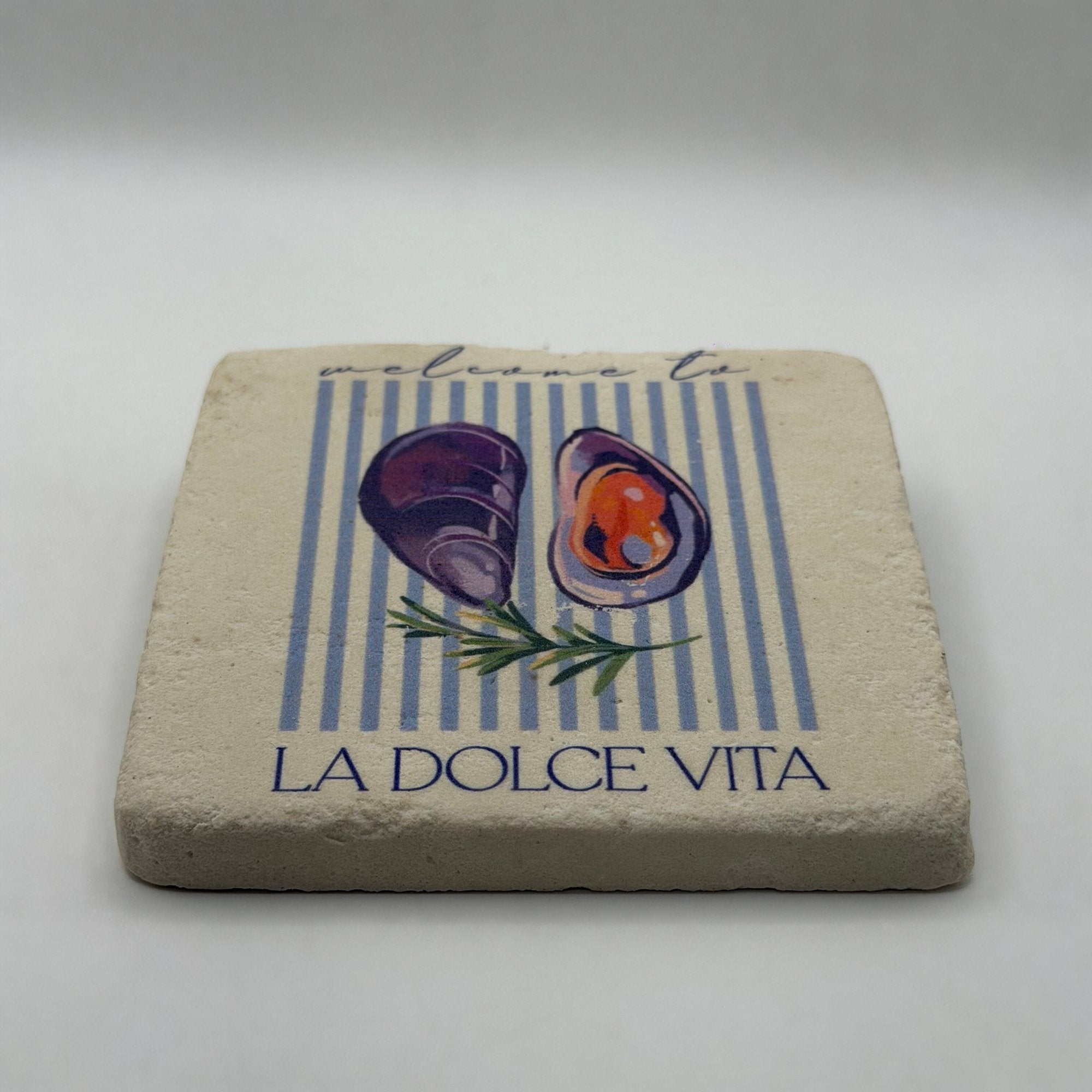 Mussel shell design printed on square travertine stone coaster
