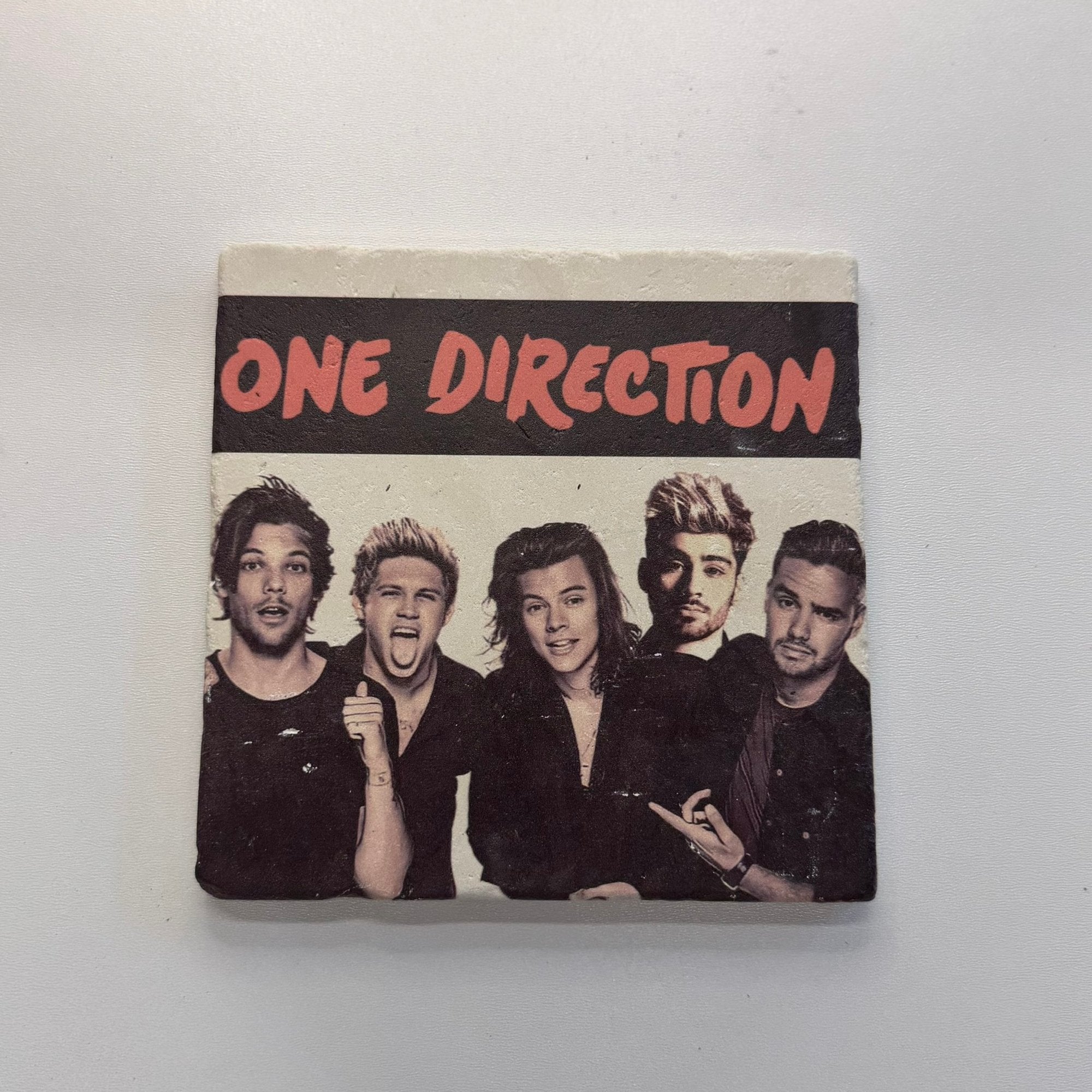 One Direction Natural Travertine Stone Hotpad artwork