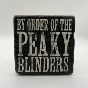 Peaky Blinders logo or character printed on square travertine stone coaster